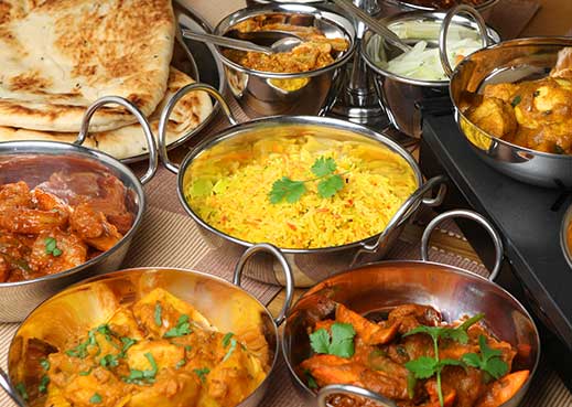 Rice, Curry, Naans in silver bowls